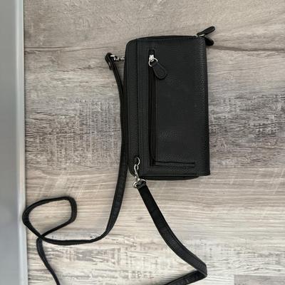 Sale Photo Thumbnail #53: Compact black purse with long strap, multiple zippers, and compartments for essentials.