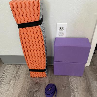 Sale Photo Thumbnail #60: Includes a foldable orange/gray foam mat, two purple yoga blocks, and a yoga strap — ideal for stretching and fitness.