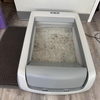 Sale Photo Thumbnail #62: Automatic litter box that rakes waste into a compartment, reducing daily scooping.