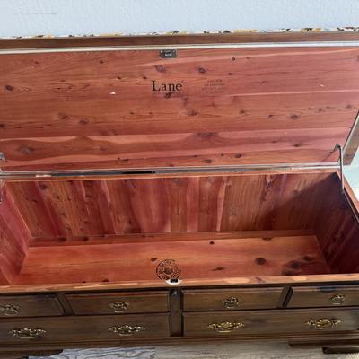 Sale Photo Thumbnail #64: Vintage Lane  wooden bench with floral cushioned seat, three throw pillows, and multiple drawers for storage.