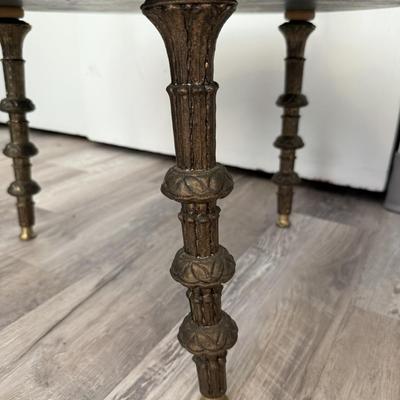 Sale Photo Thumbnail #69: Set of two matching round glass-top side tables featuring ornate gold-tone cherub supports and decorative legs. Mid-century Hollywood Regency style.