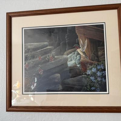 Sale Photo Thumbnail #74: Nature-inspired lithograph print of a hummingbird in flight near rustic rocks and flowers. Professionally matted and framed in wood. Signed and numbered.