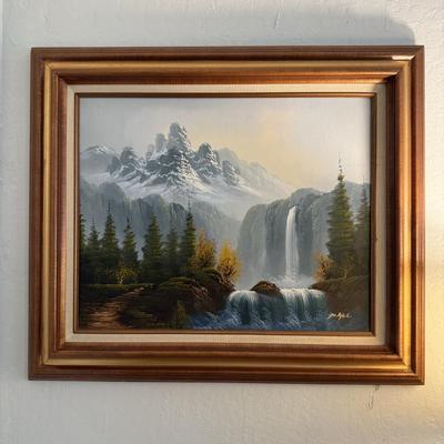 Sale Photo Thumbnail #98: Striking oil painting of a dramatic snow-capped mountain with cascading waterfalls, signed by artist.