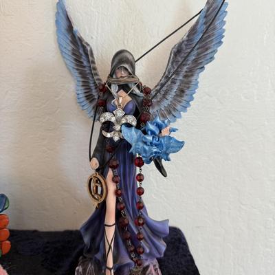 Sale Photo Thumbnail #102: Detailed figurine of a hooded angel with wings and flowing gown
(Necklaces are off of it now) only the figurine