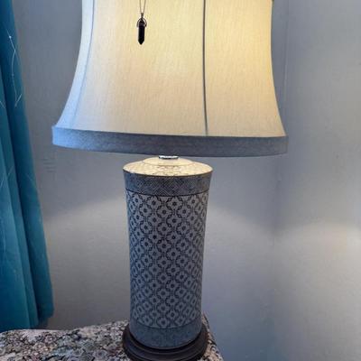 Sale Photo Thumbnail #109: Tall ceramic lamp with geometric patterned base and fabric shade, modern yet classic.