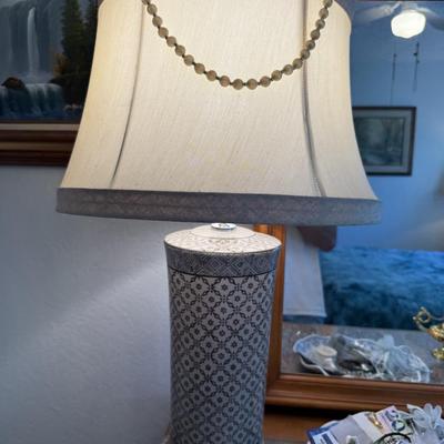 Sale Photo Thumbnail #110: Tall ceramic lamp with geometric patterned base and fabric shade, modern yet classic.