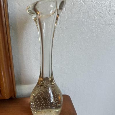 Sale Photo Thumbnail #112: Clear glass bud vase with elongated neck and controlled bubble design in the base.