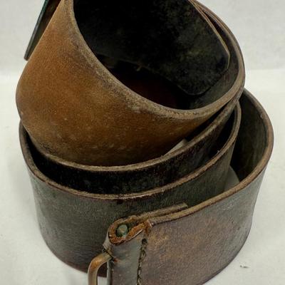 Sale Photo Thumbnail #38: Age unknown. Buckle has some green corrosion.  Belt was stored in a rolled-up manner, but is intact with no splits or fraying.