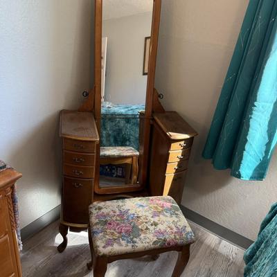 Sale Photo Thumbnail #114: Charming vanity set with tall framed mirror, side drawers, and floral upholstered bench.