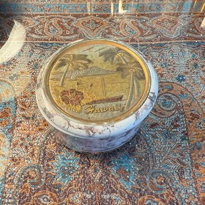 Sale Photo Thumbnail #130: Round lidded box with scenic Hawaii design, palm trees and sailboat motif on lid.