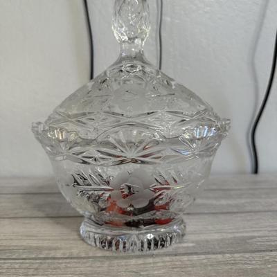 Sale Photo Thumbnail #134: Elegant clear cut-glass candy dish with lid and floral etching, perfect for display or serving.