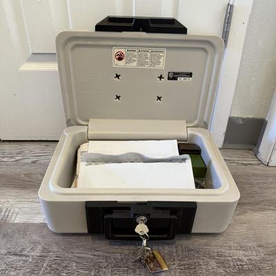 Sale Photo Thumbnail #136: Safe with key
(Contents inside not included)