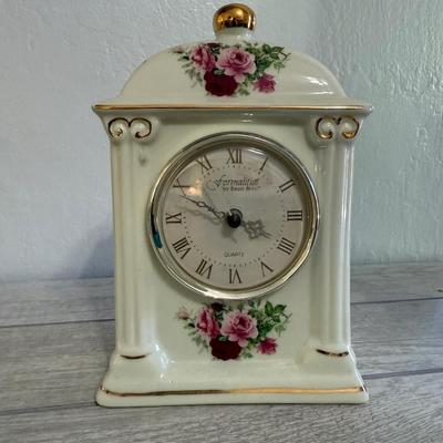 Sale Photo Thumbnail #140: “Formalities by Baum Bros” porcelain mantel clock with rose floral pattern and gold accents.