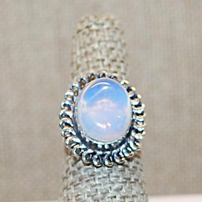 Size 6 Marked .925 Translucent Light Blue OPAL Style Gemstone Ring with a Rope Surround on a Silver-Plated Band (5.4g)