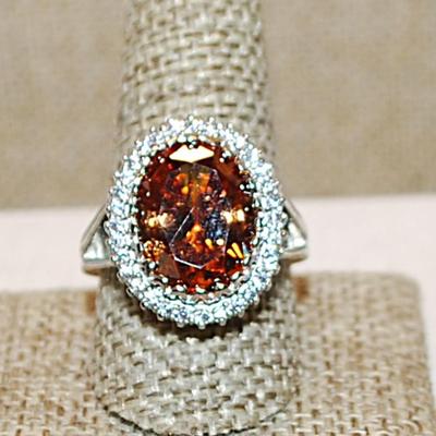 Size 10½ Marked .925 Large ORANGE AMBER Oval Stone with Nested Full Surround on a Silver Band (8.7g)