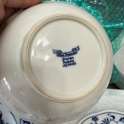 Sale Photo Thumbnail #210: Vintage Blue Danube porcelain china set in the classic “Blue Onion” pattern. Features delicate cobalt blue floral and vine motifs on white porcelain, inspired by traditional European design. This timeless and collectible set includes plates and bowls,