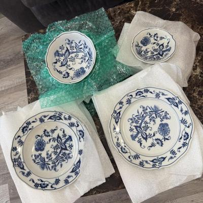 Sale Photo Thumbnail #208: Vintage Blue Danube porcelain china set in the classic “Blue Onion” pattern. Features delicate cobalt blue floral and vine motifs on white porcelain, inspired by traditional European design. This timeless and collectible set includes plates and bowls,