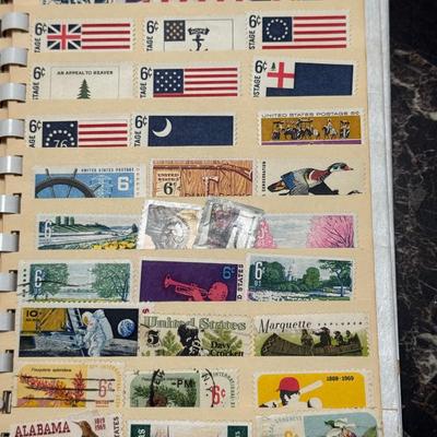 Sale Photo Thumbnail #222: Extensive mid-20th century U.S. stamp collection housed in a vintage Paragon Stock Book. This lot includes many commemoratives from the 1950s through 1970s, with a strong mix of mint plate blocks and single issues. Themes cover a wide range of U.S. histor
