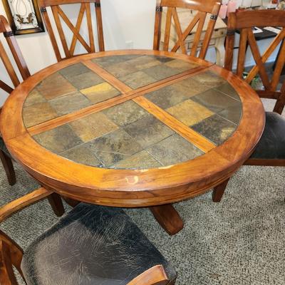Sale Photo Thumbnail #6: Sturdy dining room table with 5 chairs and a leaf. Clean and ready for your next gathering.