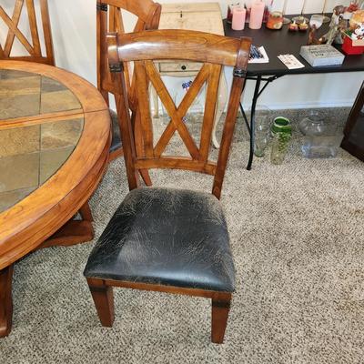 Sale Photo Thumbnail #7: Sturdy dining room table with 5 chairs and a leaf. Clean and ready for your next gathering.