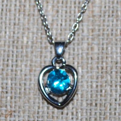 Round Blue Stone in a HEART Setting PENDANT (½" x ½") on a Silver Tone Necklace Chain 16" L