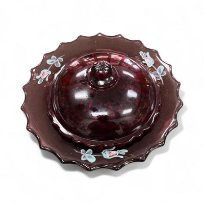 Sale Photo Thumbnail #658: Vintage Covered Candy Dish or Butter Dish featuring a ruffled edge and hand painted floral details.  The color is cranberry or amethyst.  The lid color appears to be slightly different than the dish