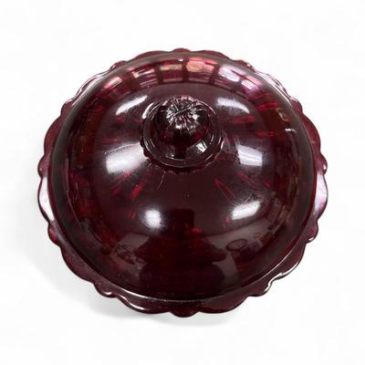 Sale Photo Thumbnail #656: Vintage Covered Candy Dish or Butter Dish featuring a ruffled edge and hand painted floral details.  The color is cranberry or amethyst.  The lid color appears to be slightly different than the dish