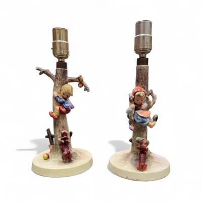Sale Photo Thumbnail #660: Goebel Hummel L Lamp Set Boy and Girl in the Apple Tree  Hum 56/A Culprits and Hum 56?B  1970's  In working condition  No Lamp Shades   12" Tall One dog ear on boy lamp broken off.