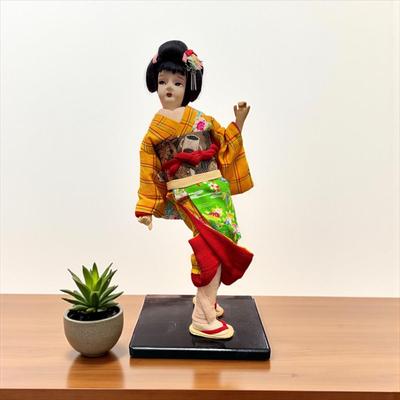 Sale Photo Thumbnail #663: Japanese Geisha or Maiko Doll..  Nihon Ningyo dressed in a vibrant kimono   13" Tall  on a wooden base