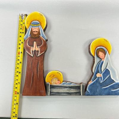 Sale Photo Thumbnail #672: Wooden Hand Painted Nativity Scene with Mary, Joseph and Baby Jesus.   Signed by the Artist