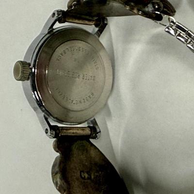 Sale Photo Thumbnail #144: Watch seems damaged, cannot wind it or set the hands.  Two large portions are made from Coin Silver (CS = 90%),  Total watch weight is 32.6g.