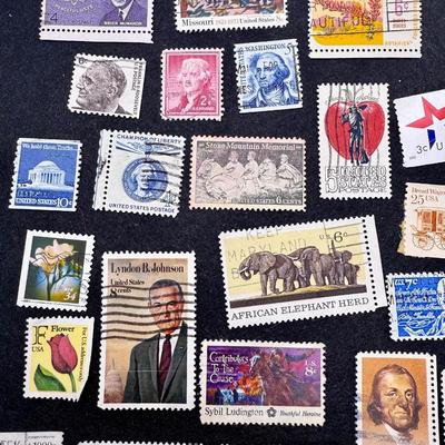Sale Photo Thumbnail #338: Many different types and denominations. Many are used and have cancellation marks.  See photos for what’s included.