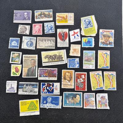 Sale Photo Thumbnail #334: Many different types and denominations. Many are used and have cancellation marks.  See photos for what’s included.