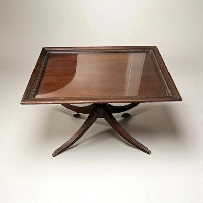 Sale Photo Thumbnail #718: Vintage Duncan Phyfe Mahogany removeable Glass Top Table.  minor scratches in the glass top
19"x28"X19"