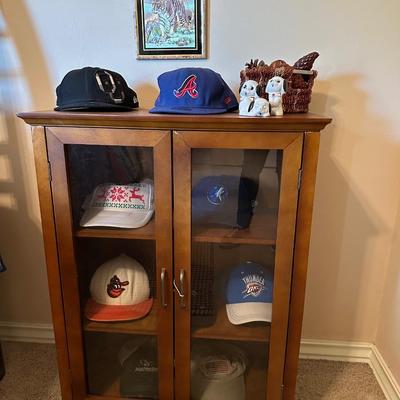 Furniture -bookshelf w/glass doors plus decor & hats