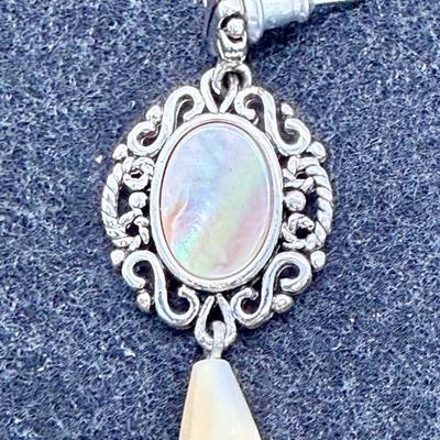 Sale Photo Thumbnail #366: Silvertone metal, mother-of-pearl ovals and yellowish teardrops.  Good condition.