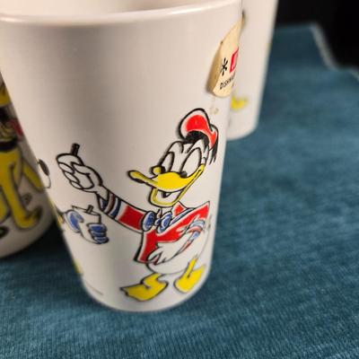 Sale Photo Thumbnail #20: This auction lot is for a Vintage 1950's Cereal Bowl and 8 Juice Glasses.  The bowl appears unused and is about 5.5-inches in diameter x 2-inches deep.  The cups may have light use but are also in very good condition, most still have their original price 