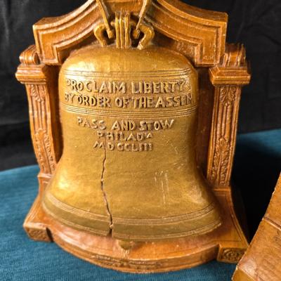 Sale Photo Thumbnail #25: This auction lot is for a set of vintage Liberty Bell Bookends.  Looks to be made of resin and are very heavy - perfect to hold up books.  They are about 6-inches tall x 6-inches wide.