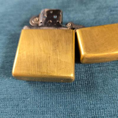 Sale Photo Thumbnail #33: This auction lot is for a newer Brass Harley Davidson Zippo Lighter.  It is marked F XV on the bottom.  Great design and appears in very good shape.  Made in USA - Bradford, PA.  Great gift idea.