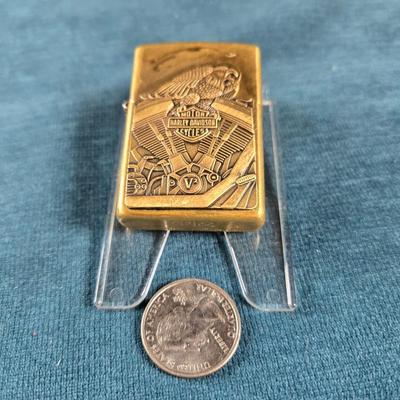 Sale Photo Thumbnail #31: This auction lot is for a newer Brass Harley Davidson Zippo Lighter.  It is marked F XV on the bottom.  Great design and appears in very good shape.  Made in USA - Bradford, PA.  Great gift idea.
