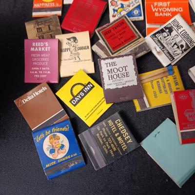 A COLLECTION OF MATCHBOOKS AND FAKE CIGARS