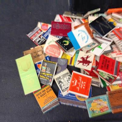 A COLLECTION OF MATCHBOOKS AND FAKE CIGARS