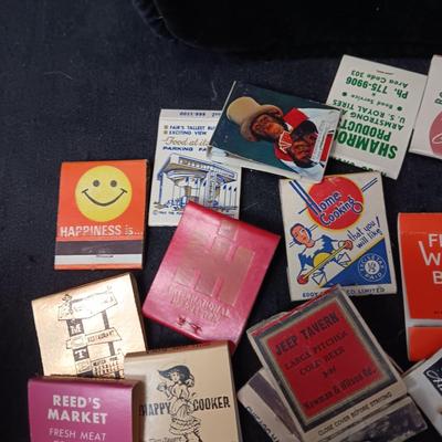 A COLLECTION OF MATCHBOOKS AND FAKE CIGARS