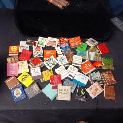 A COLLECTION OF MATCHBOOKS AND FAKE CIGARS