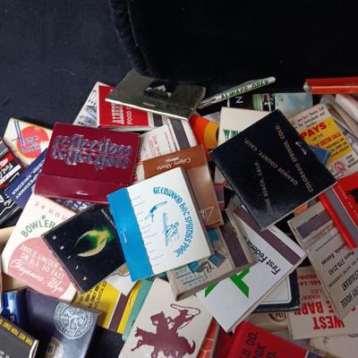 A COLLECTION OF MATCHBOOKS AND FAKE CIGARS