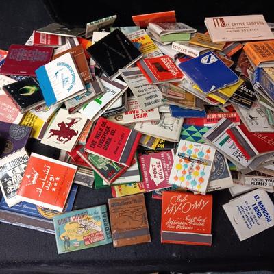 A COLLECTION OF MATCHBOOKS AND FAKE CIGARS