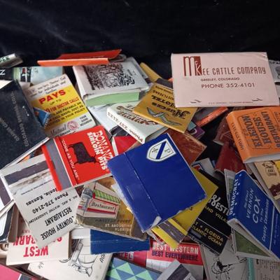 A COLLECTION OF MATCHBOOKS AND FAKE CIGARS