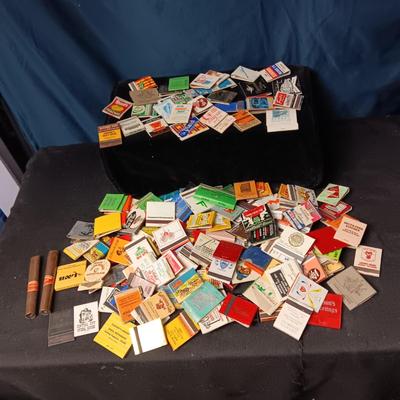 A COLLECTION OF MATCHBOOKS AND FAKE CIGARS
