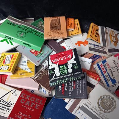 A COLLECTION OF MATCHBOOKS AND FAKE CIGARS