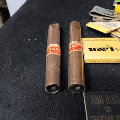 A COLLECTION OF MATCHBOOKS AND FAKE CIGARS